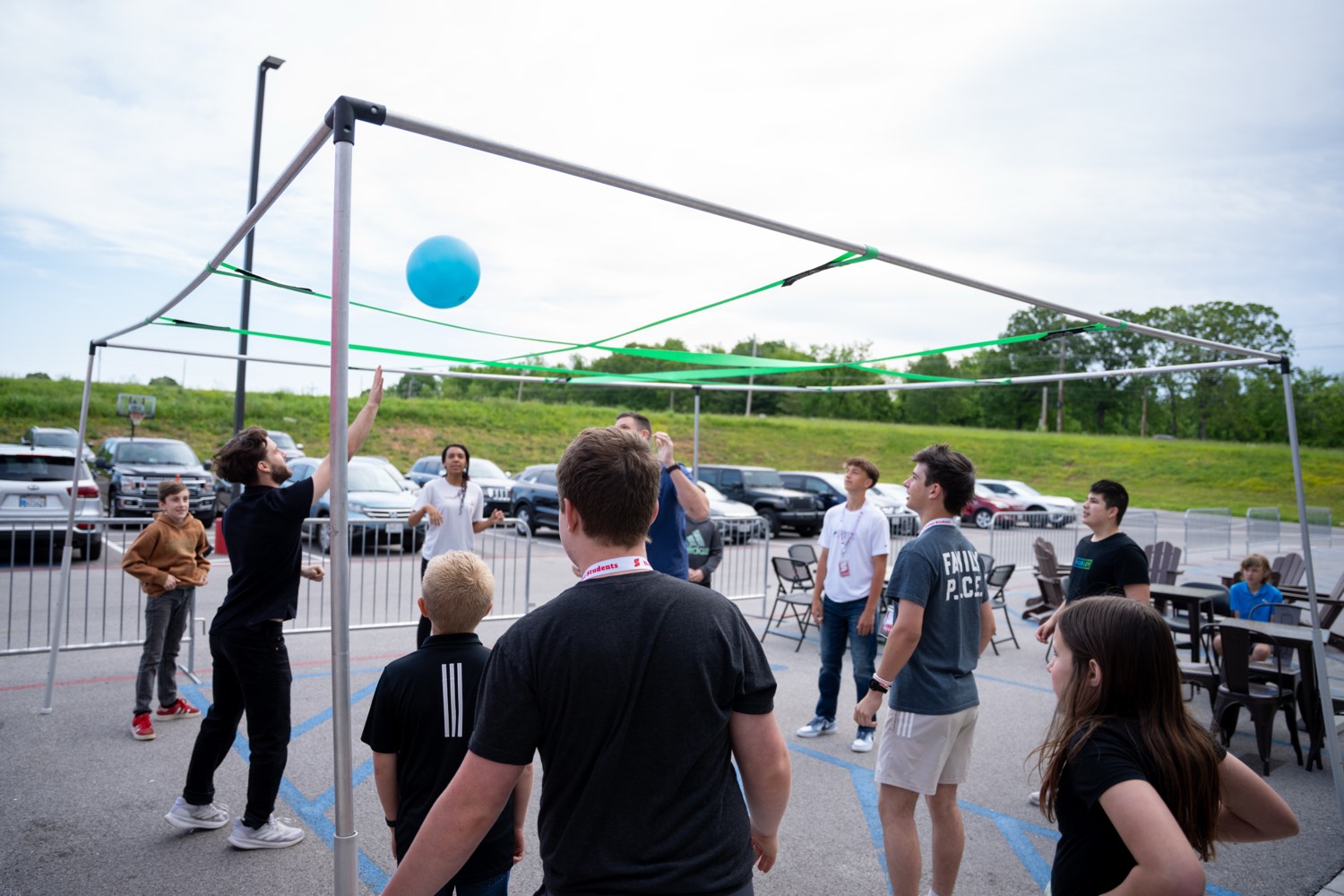 Families playing lawn games outside at a campus event