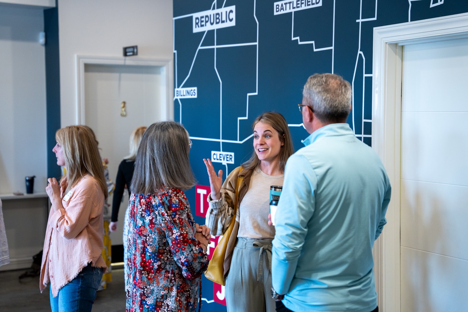 People talking together in the lobby at the Republic campus